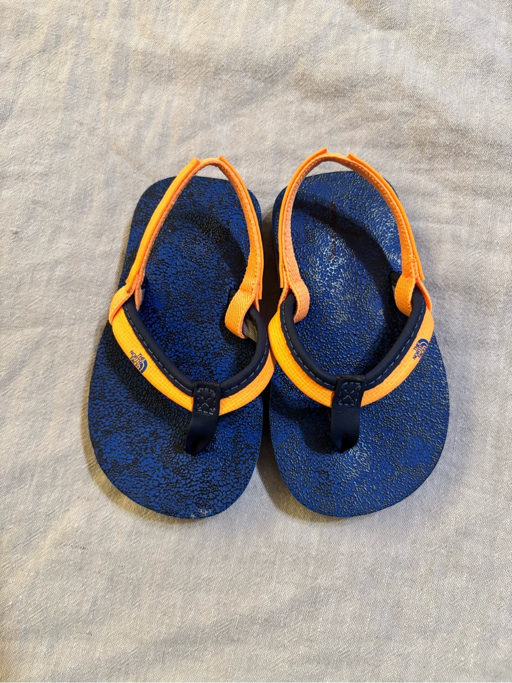 The North Face Kids Blue and Orange Flip Flops with Heel Strap NWOT